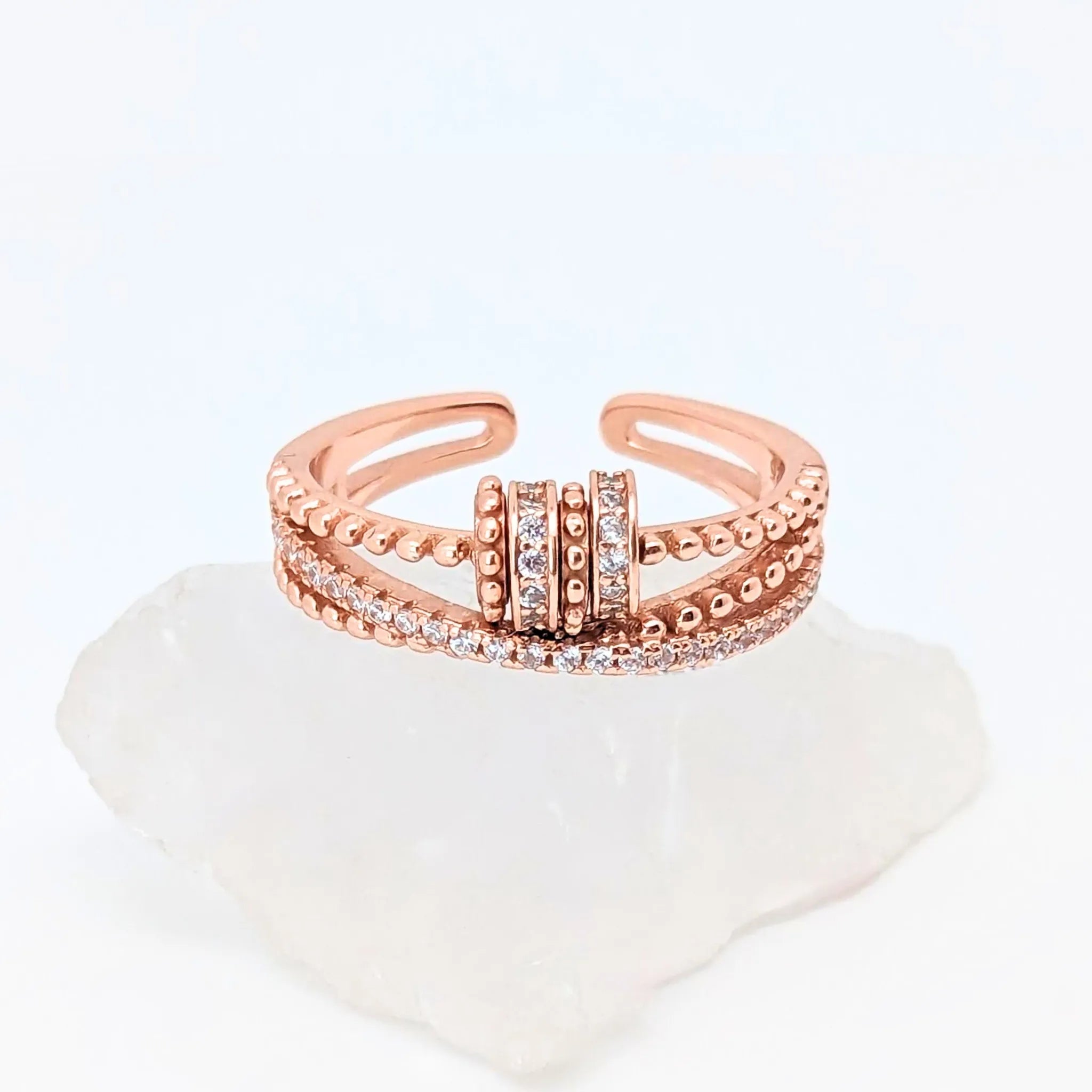 Roségouden Serenity fidget ring met witte steentjes – elegante stijl en ontspanning – Luminora