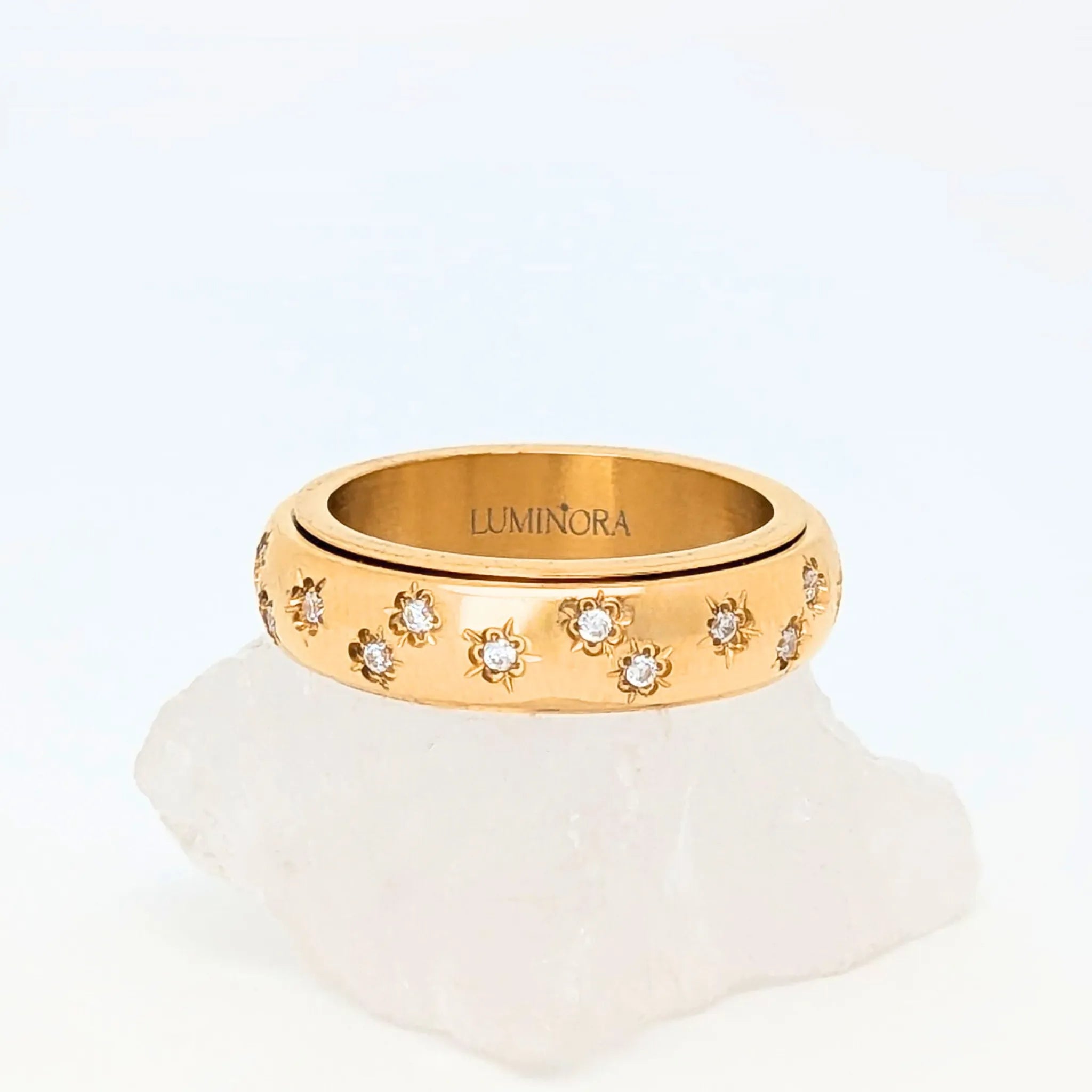 Allura Fidget Ring van goud edelstaal met bloemgravure en kleine steentjes – Luminora