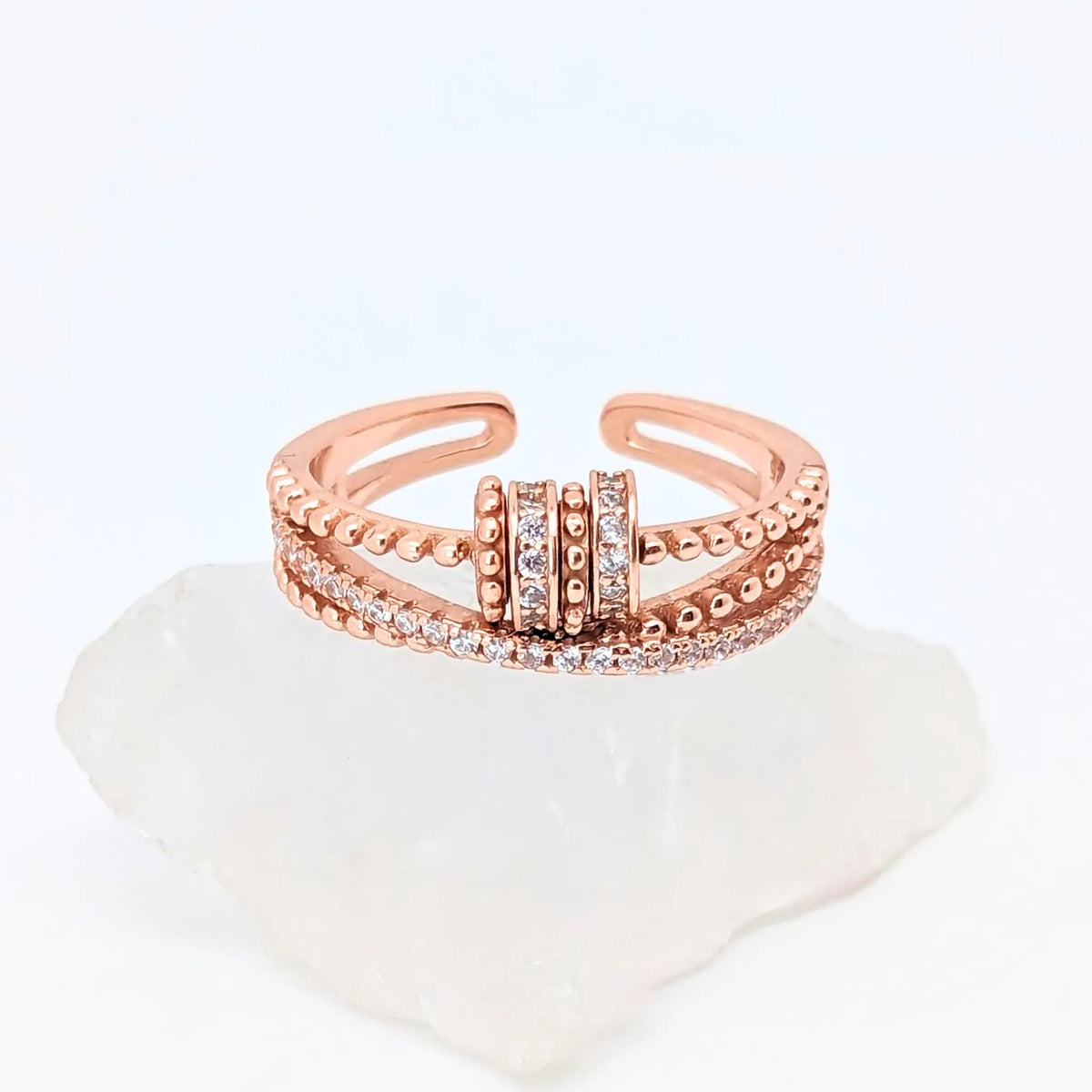 Roségouden Serenity fidget ring met witte steentjes – elegante stijl en ontspanning – Luminora